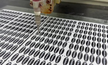 Dome label production with company name and logo